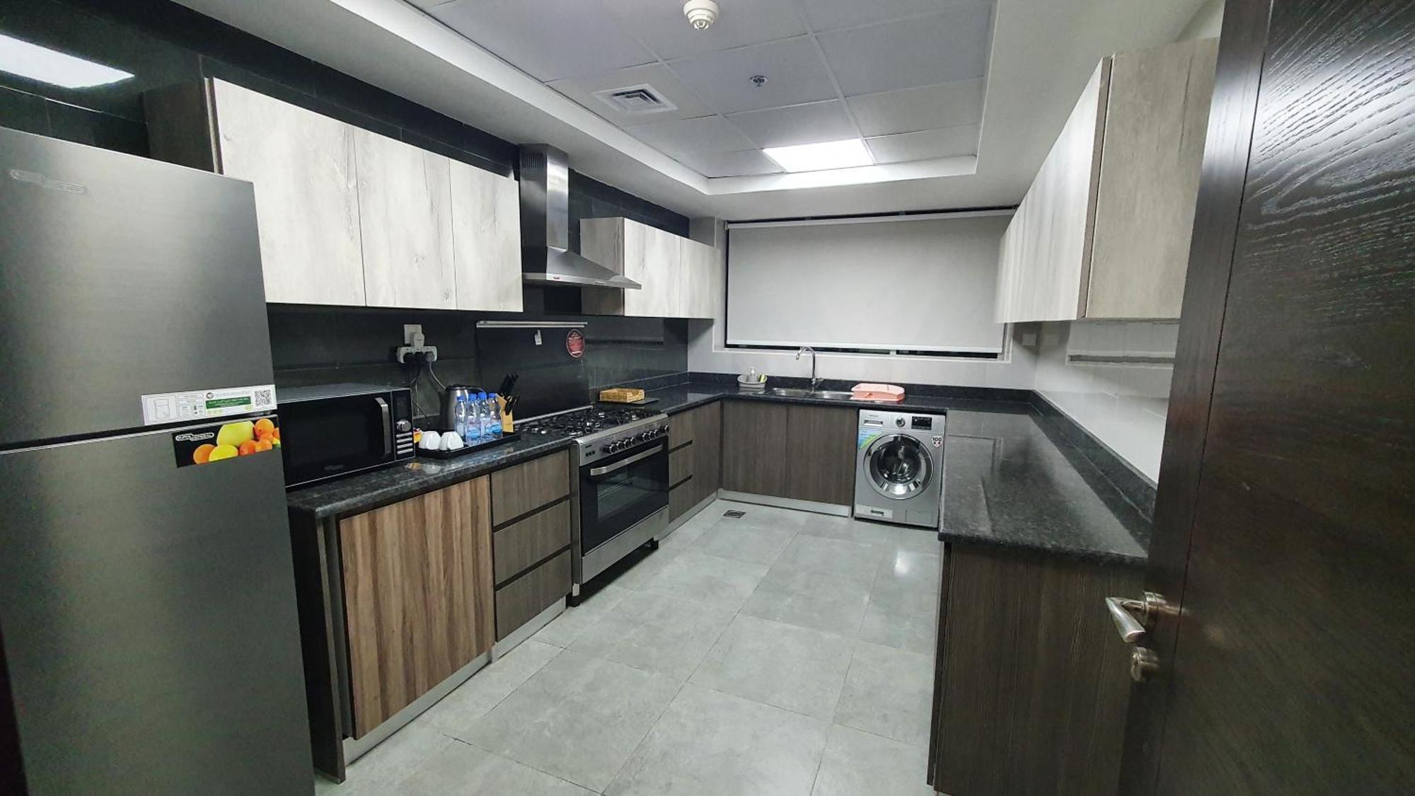 Luxe Grand Hotel Apartments Şarja Dış mekan fotoğraf A modern kitchen in Dubai